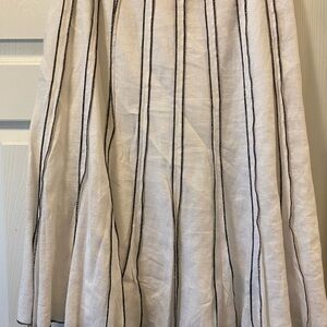 Pre-loved beautiful black and white skirt. Several stains towards the bottom.